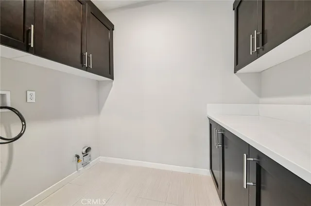 a view of an empty room with a ceiling fan