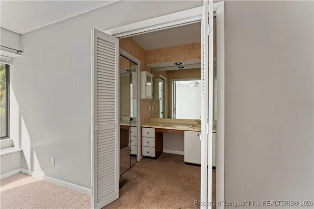 a white toilet sitting next to a bath tub