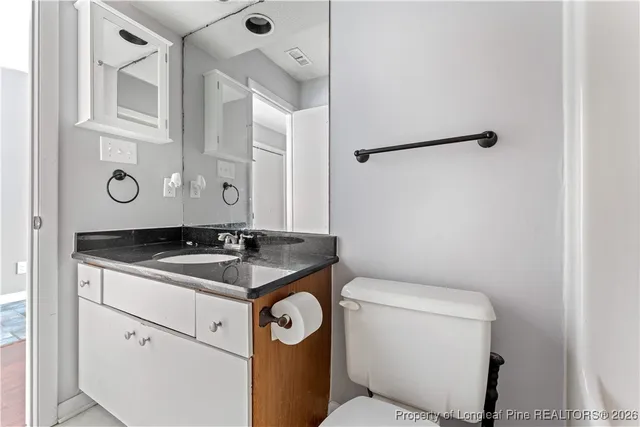 a view of an empty room with a fireplace