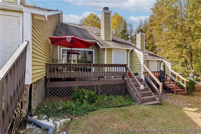 a front view of a house with outdoor seating