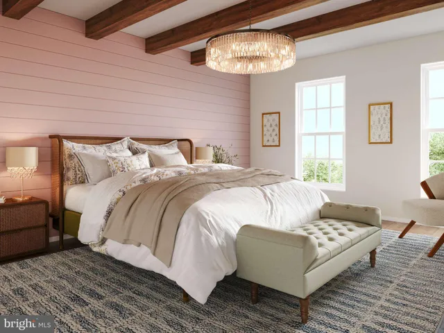 a bedroom with bed and a chandelier