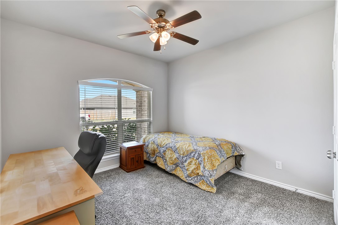 909 Davy Street Brenham, TX 77833 - Photo 23 of 35 Bedroom with carpet and ceiling fan