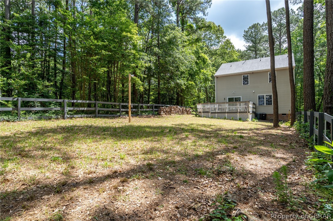 9313 South Courthouse Road Providence Forge, VA 23140 - Photo 8 of 35 a backyard of a house with table and chairs