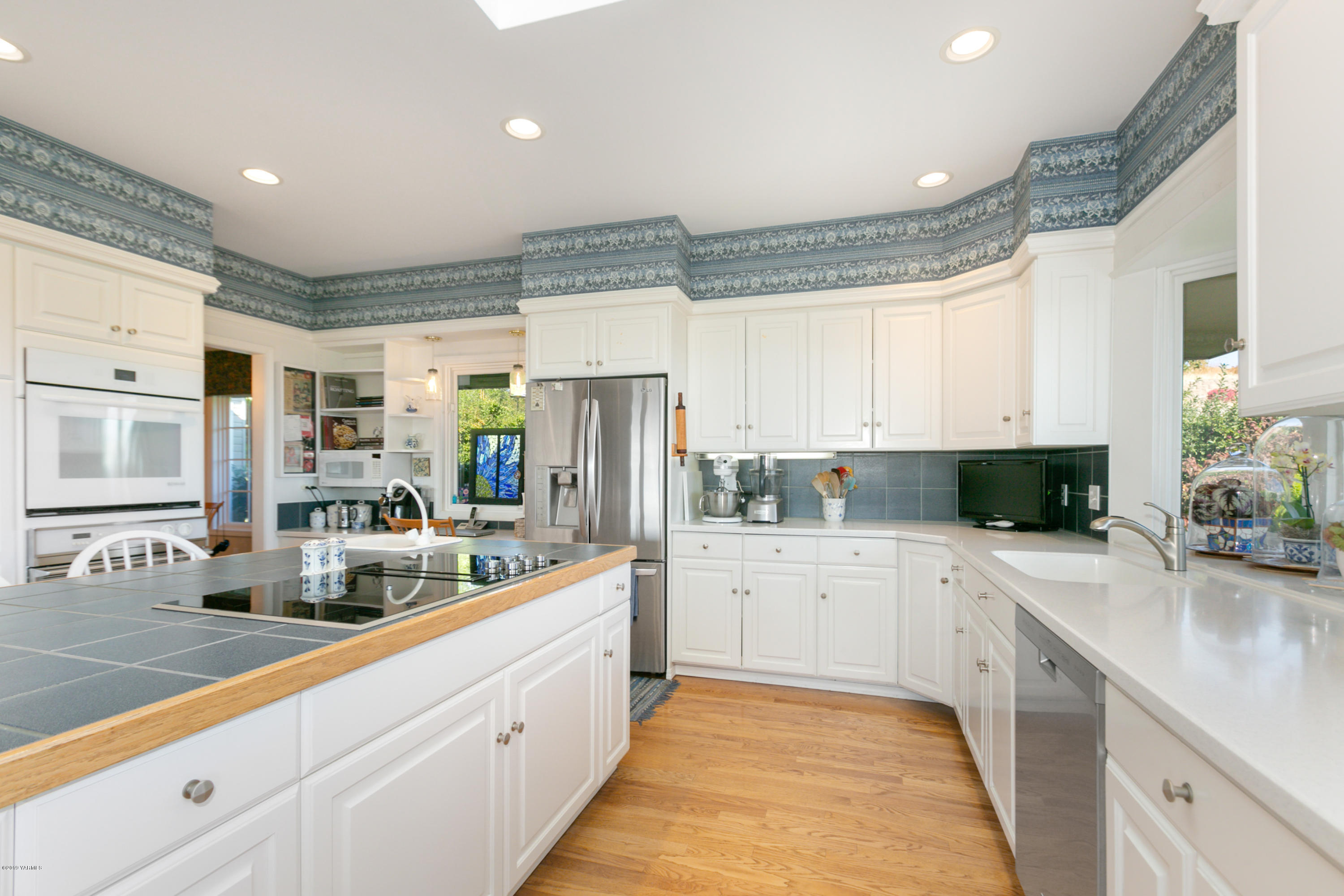 14771 Summitview Ext Road Yakima, WA 98908 - Photo 11 of 45 a large white kitchen with stainless steel appliances granite countertop a lot of counter space and a sink