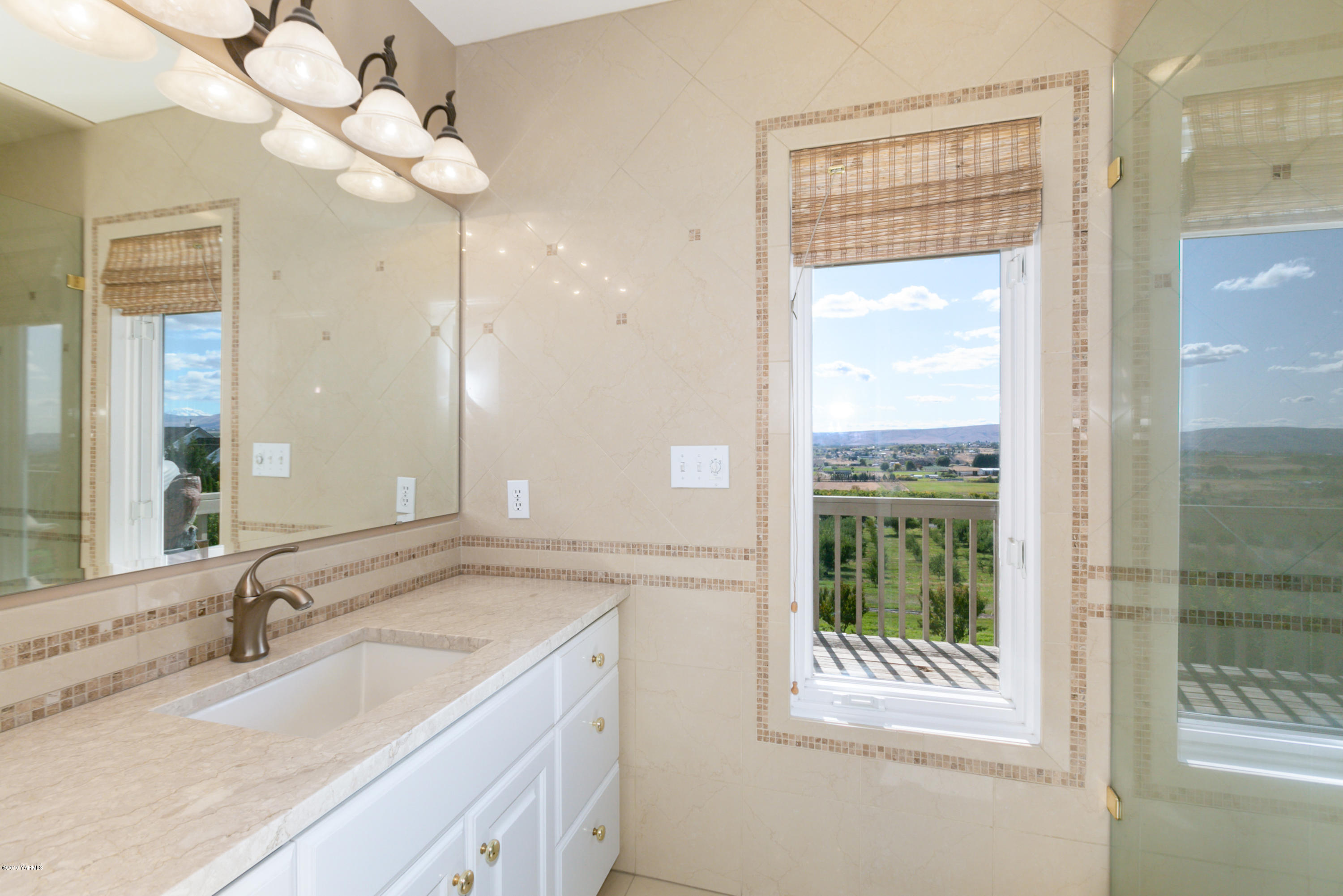 14771 Summitview Ext Road Yakima, WA 98908 - Photo 21 of 45 a bathroom with a granite countertop sink mirror and a shower