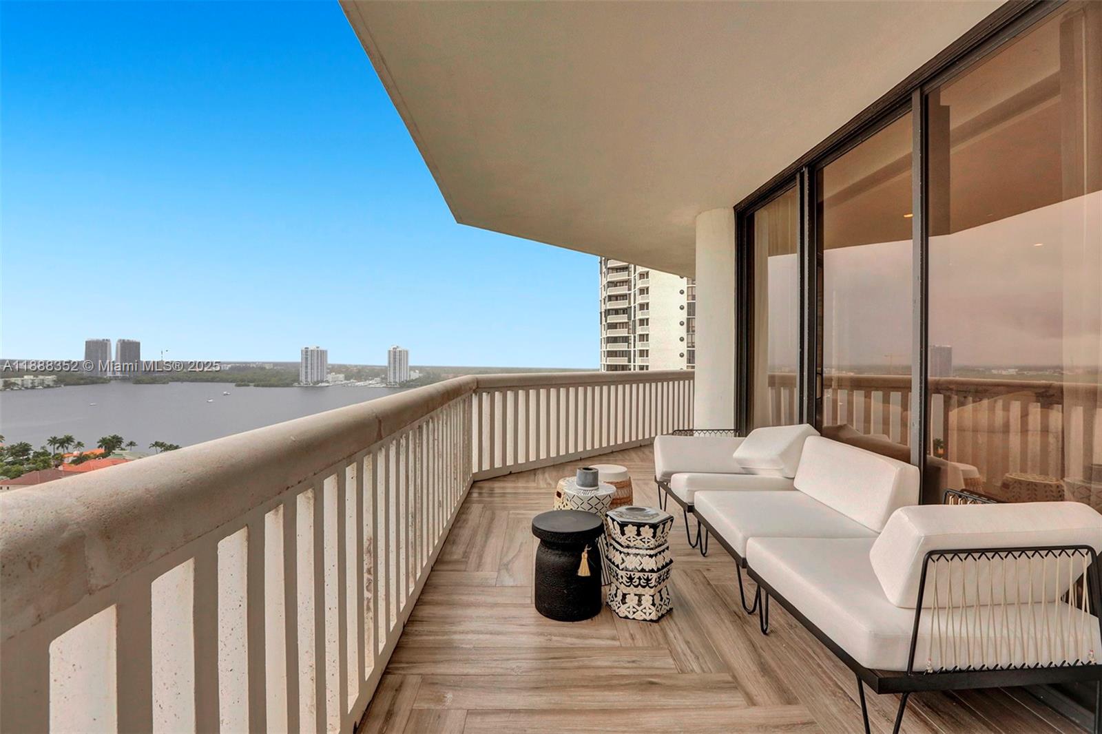 2000 Island Boulevard, Unit 2207 Aventura, FL 33160 - Photo 16 of 29 a balcony with furniture and view of ocean