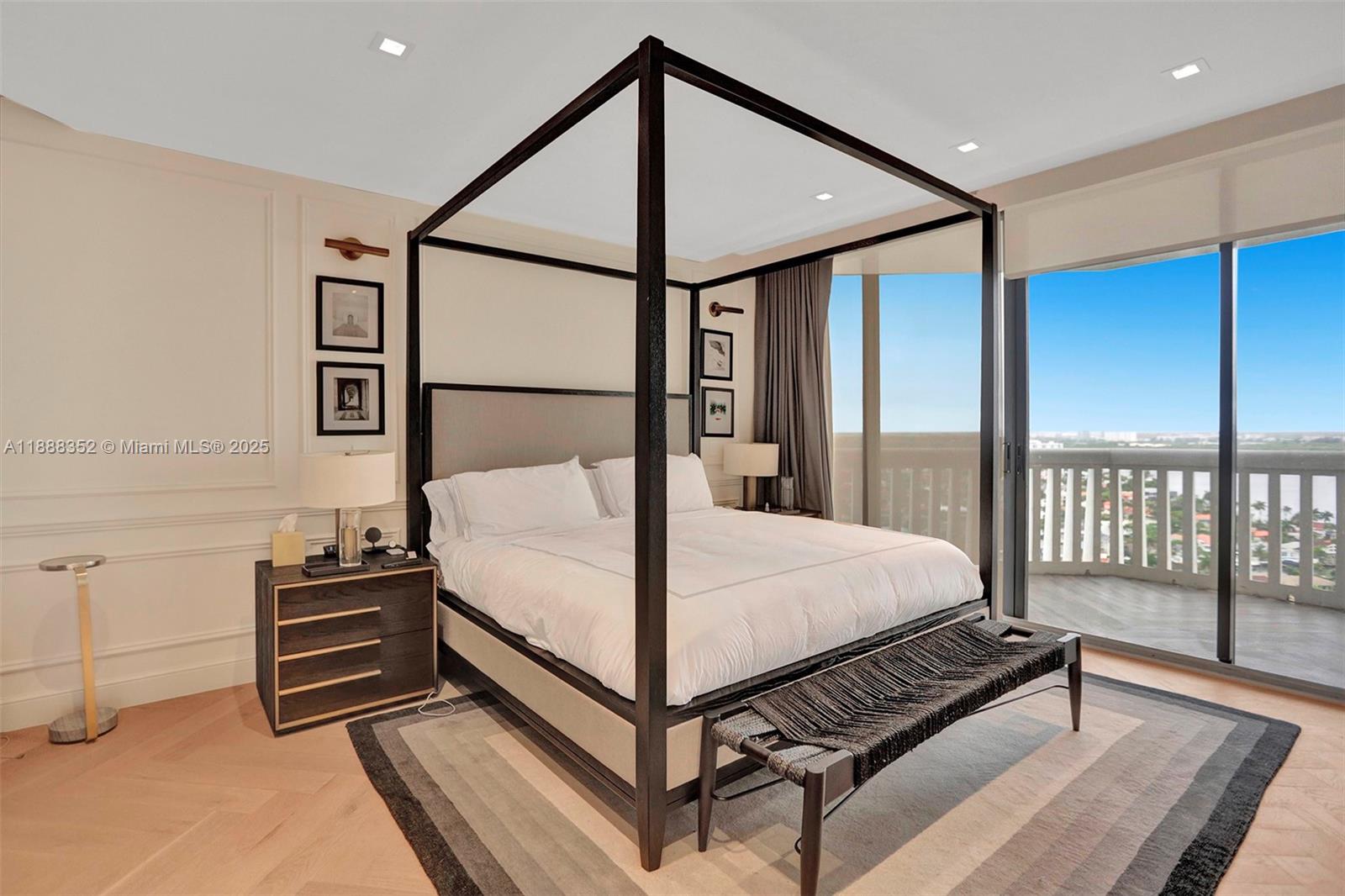 2000 Island Boulevard, Unit 2207 Aventura, FL 33160 - Photo 19 of 29 a bed room with a bed and a ceiling fan