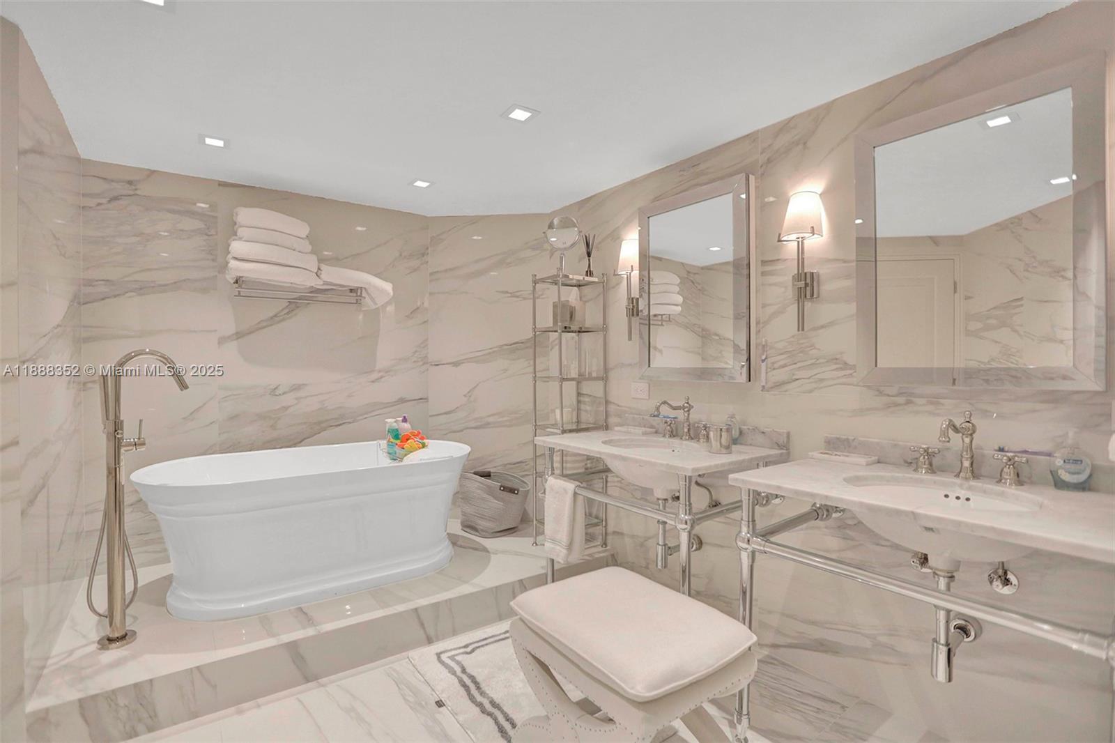 2000 Island Boulevard, Unit 2207 Aventura, FL 33160 - Photo 2 of 29 a bathroom with a sink a toilet and bathtub