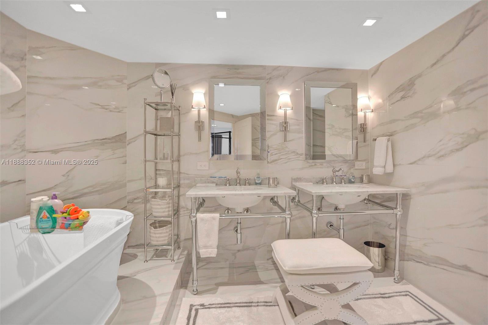 2000 Island Boulevard, Unit 2207 Aventura, FL 33160 - Photo 21 of 29 a bathroom with a sink a toilet and shower