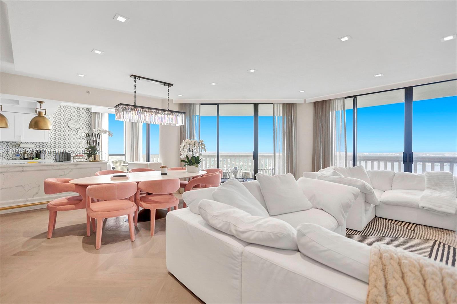 2000 Island Boulevard, Unit 2207 Aventura, FL 33160 - Photo 22 of 29 a living room with furniture a large window and a table