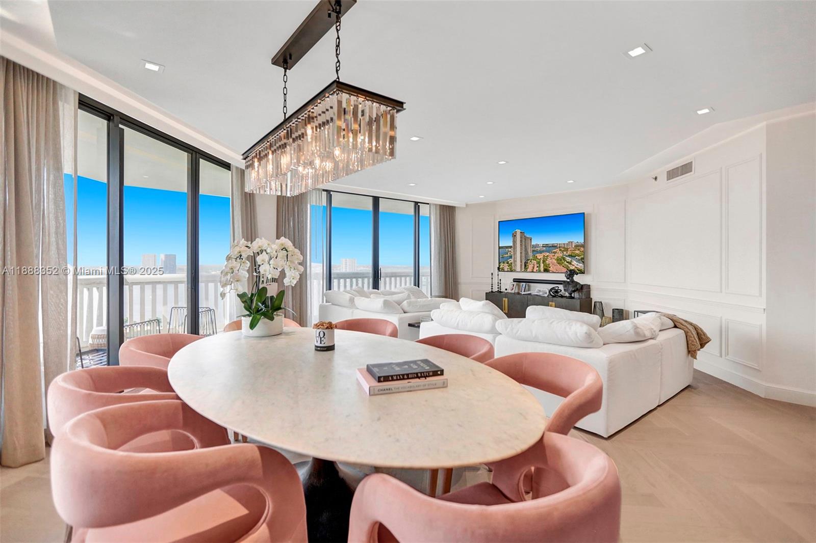 2000 Island Boulevard, Unit 2207 Aventura, FL 33160 - Photo 27 of 29 a living room with furniture and a large window