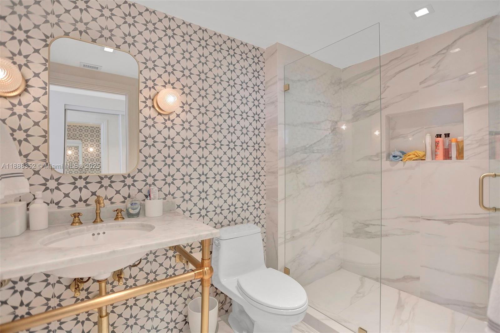 2000 Island Boulevard, Unit 2207 Aventura, FL 33160 - Photo 5 of 29 a bathroom with a granite countertop sink a toilet and shower