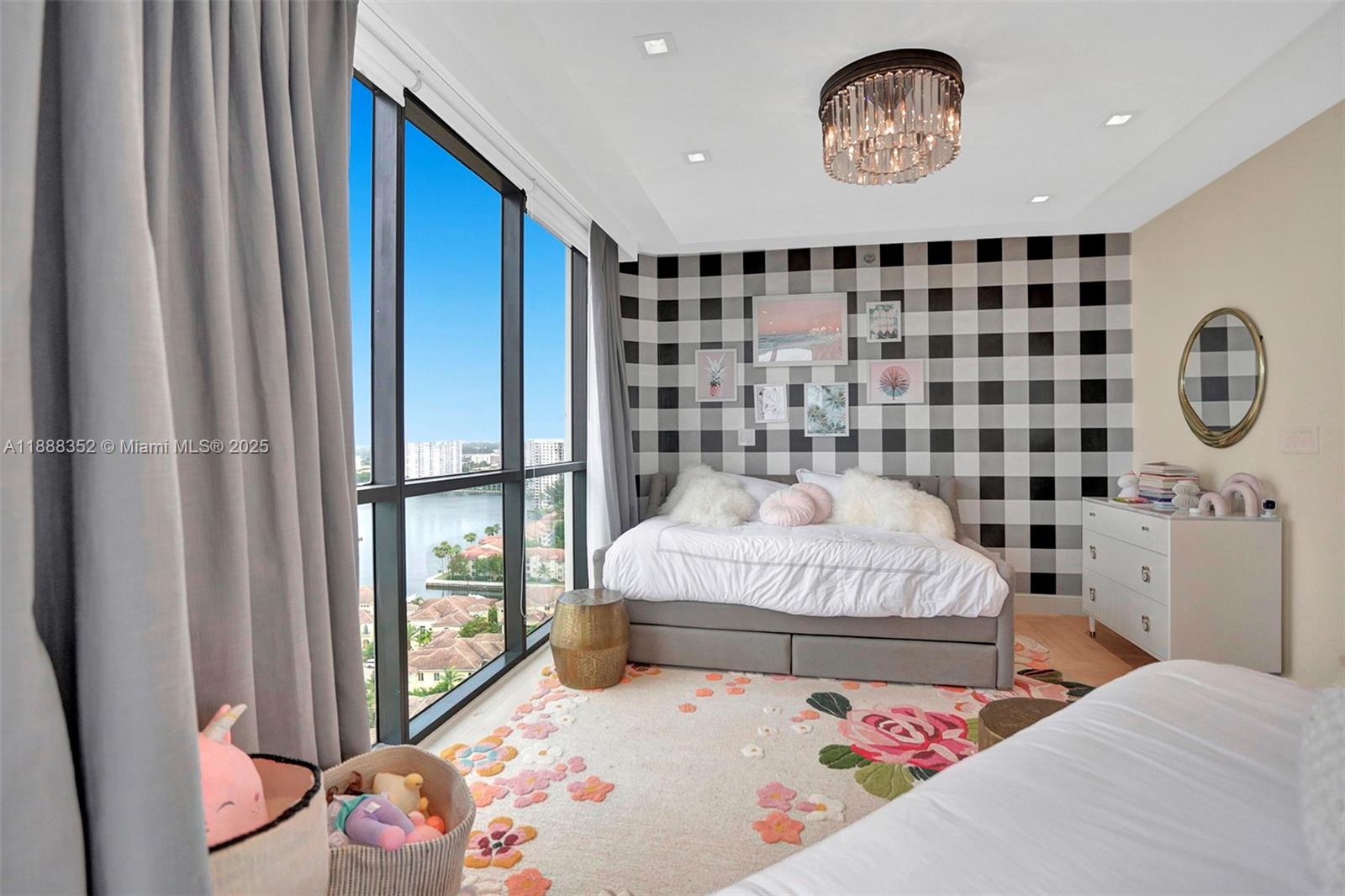 2000 Island Boulevard, Unit 2207 Aventura, FL 33160 - Photo 7 of 29 a bedroom with a bed and a window