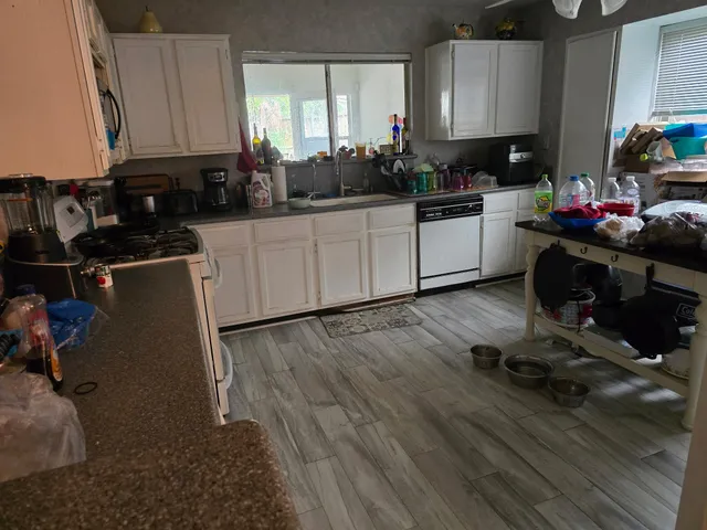 a bedroom with a bed and a chair