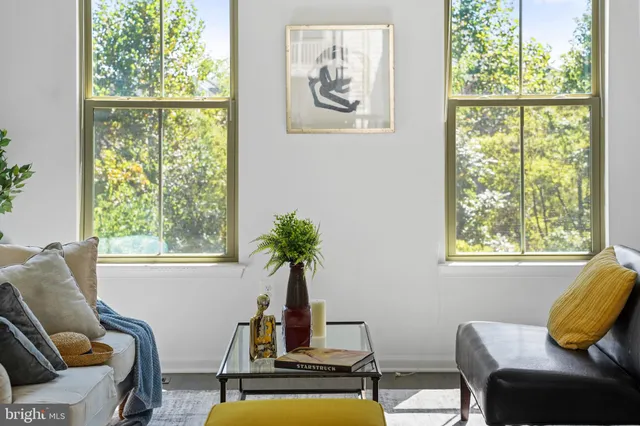 a bedroom with a bed and a lamp