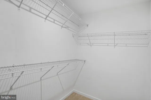 a bathroom with a toilet sink and a window