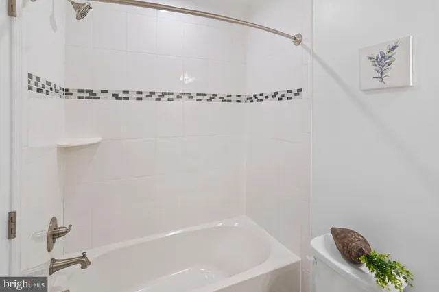 a bathroom with a sink vanity and a mirror