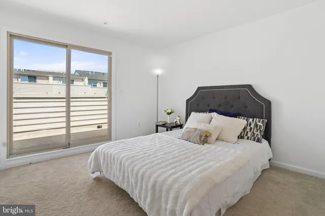 a view of a patio with table and chairs with wooden floor and fence