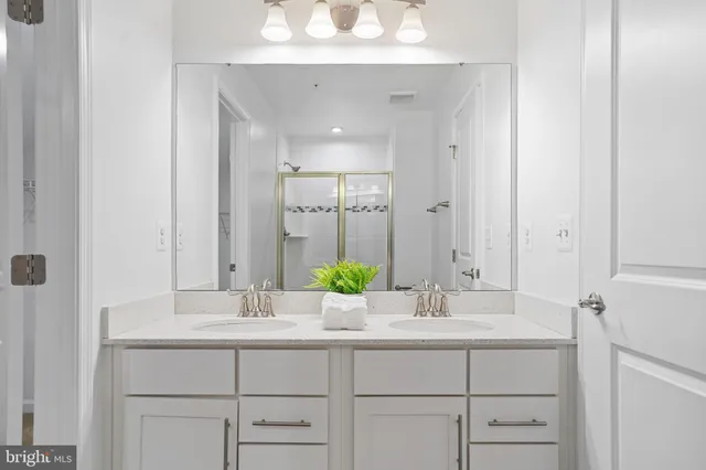 a white toilet sitting next to a shower