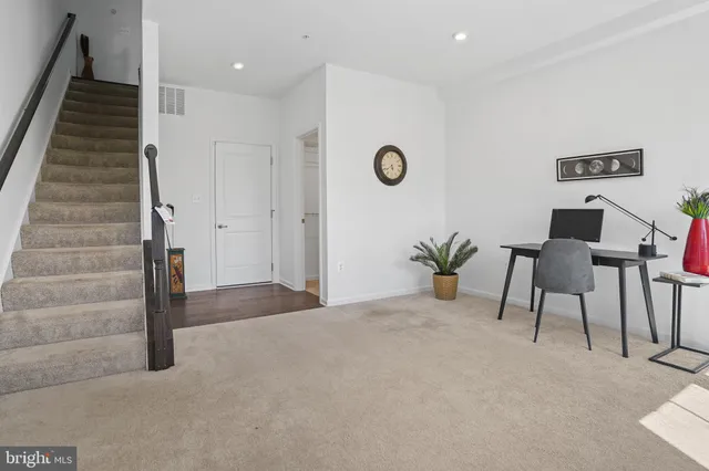 a kitchen with stainless steel appliances granite countertop a sink a stove and a counter space
