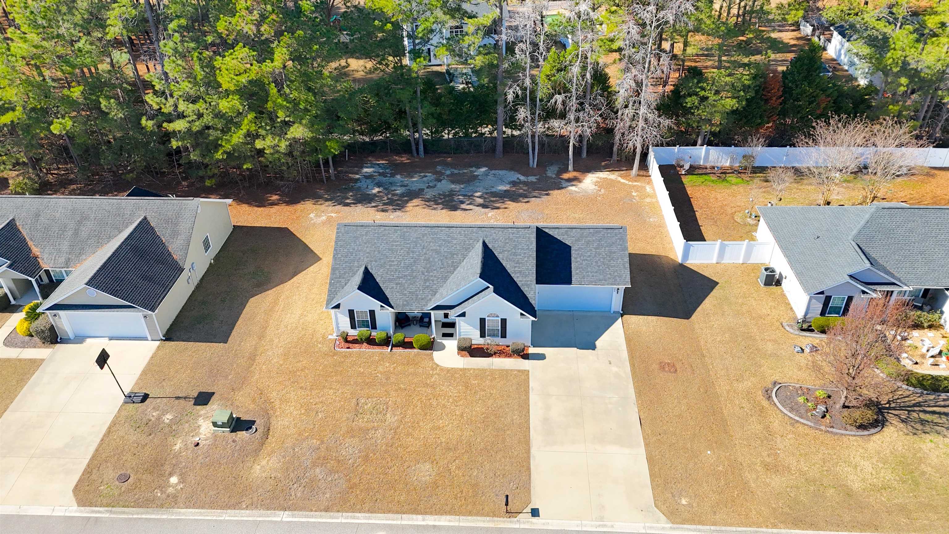 233 Macarthur Drive Conway, SC 29527 - Photo 2 of 21 Aerial view of property and surrounding area featuring a tree filled landscape