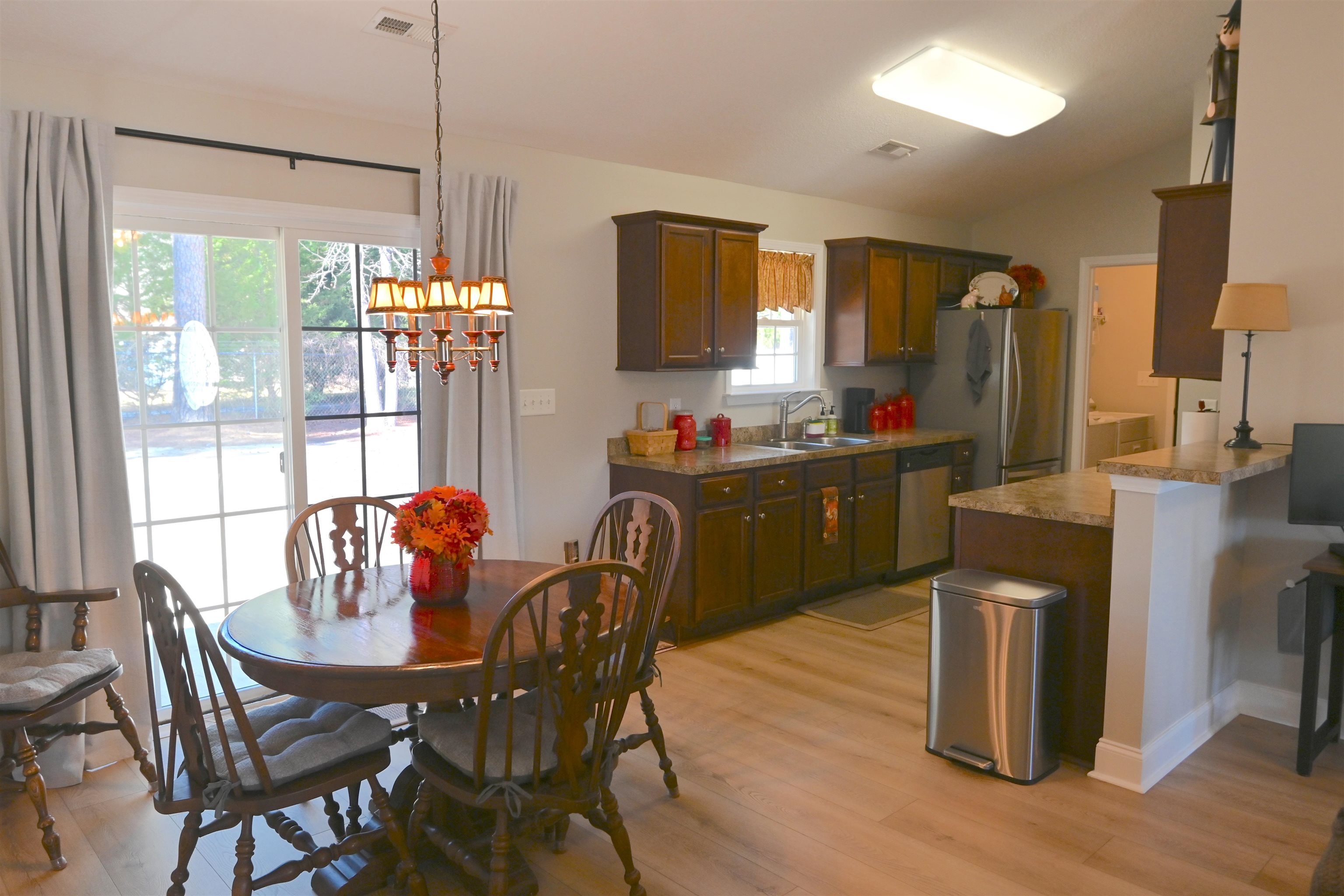 233 Macarthur Drive Conway, SC 29527 - Photo 7 of 21 Dining space with a chandelier, light wood-style floors, and vaulted ceiling
