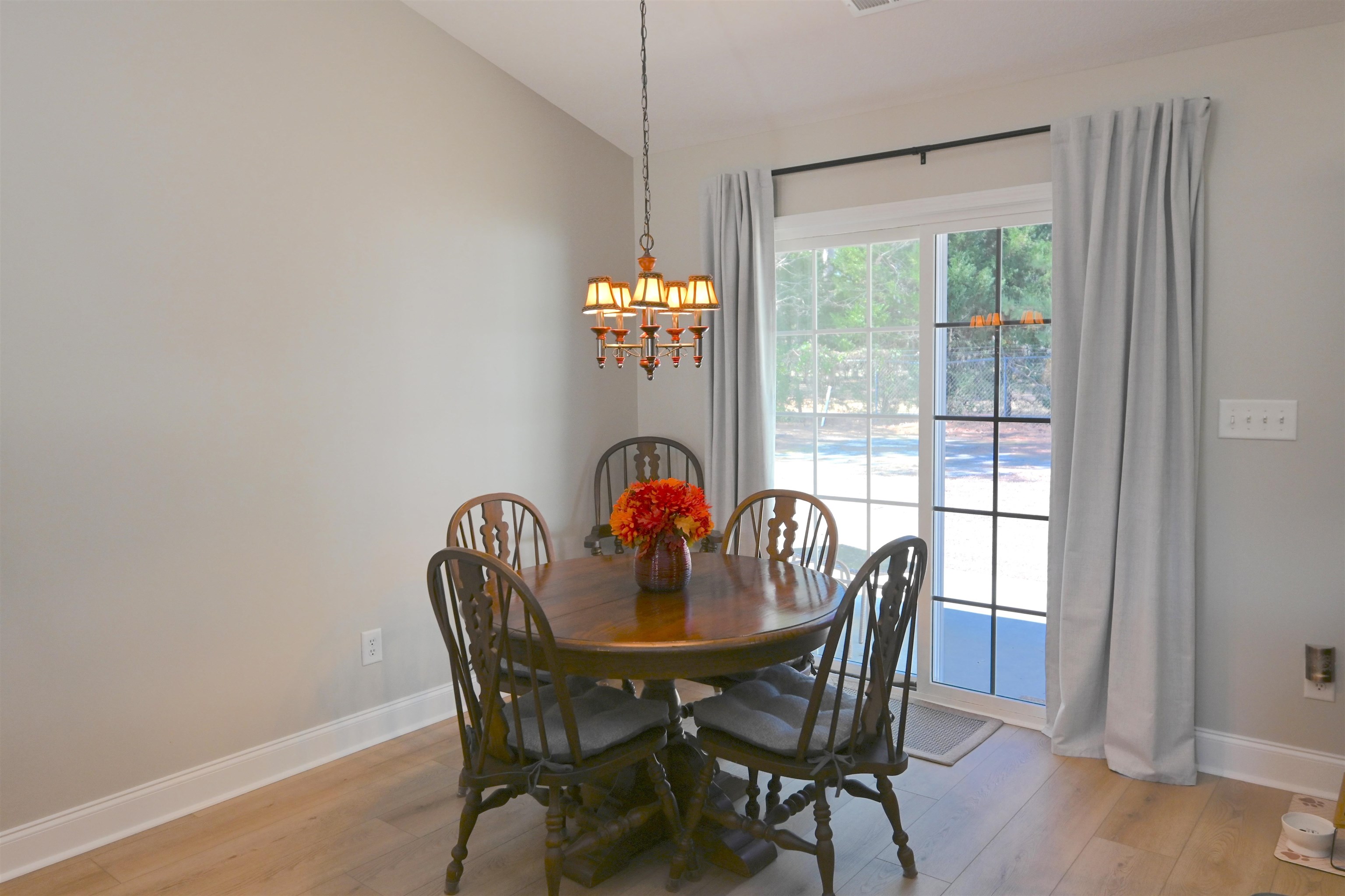 233 Macarthur Drive Conway, SC 29527 - Photo 8 of 21 Dining room featuring light wood finished floors, a chandelier, and vaulted ceiling