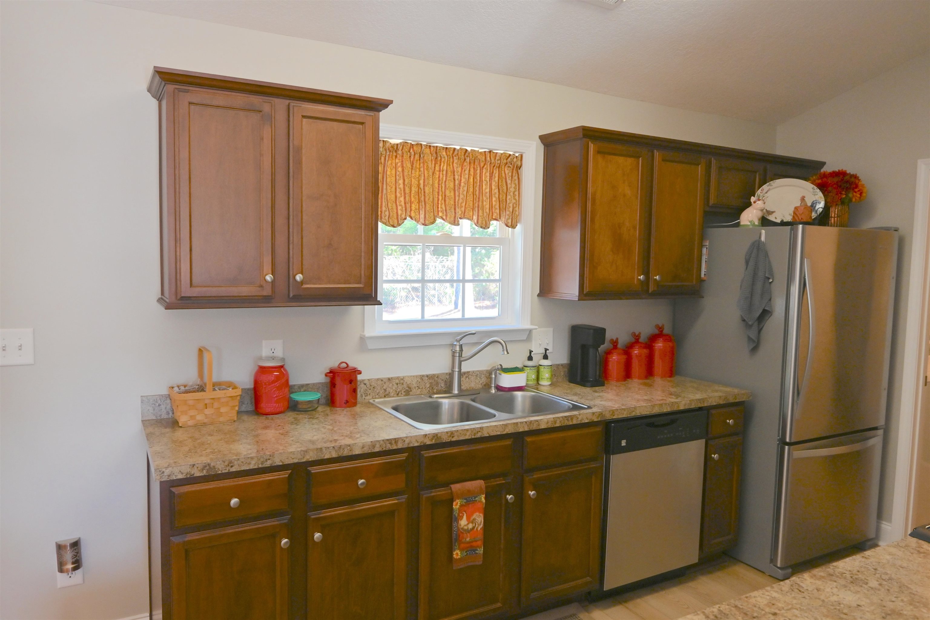 233 Macarthur Drive Conway, SC 29527 - Photo 9 of 21 Kitchen with stainless steel appliances, light countertops, and brown cabinets