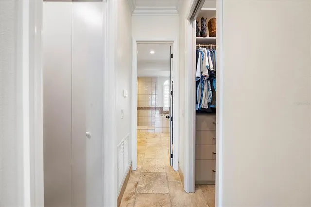 a bathroom with a granite countertop toilet sink and mirror