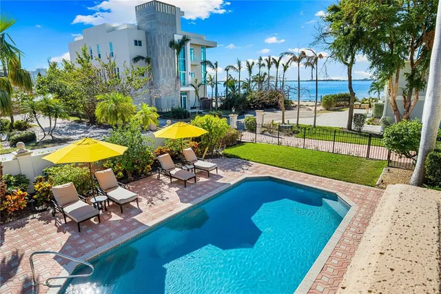 a view of a swimming pool with a lounge chairs