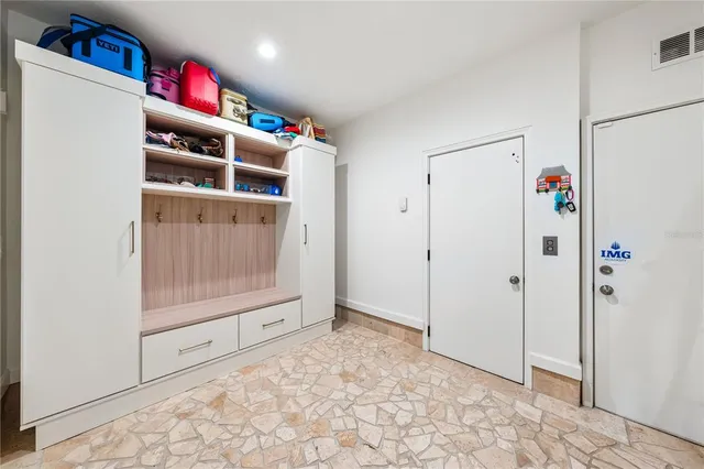 an aerial view of a house with outdoor space and swimming pool