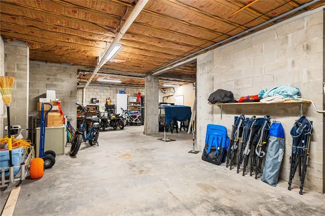 a view of a swimming pool with lounge chairs in patio