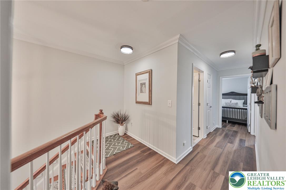 163 Muirfield Way Easton, PA 18042 - Photo 17 of 48 a view of a hallway with wooden floor and staircase