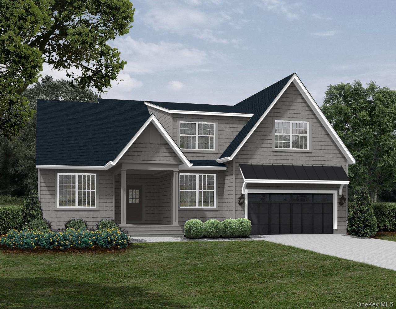 Craftsman-style home with concrete driveway, an attached garage, a standing seam roof, covered porch, and a front yard