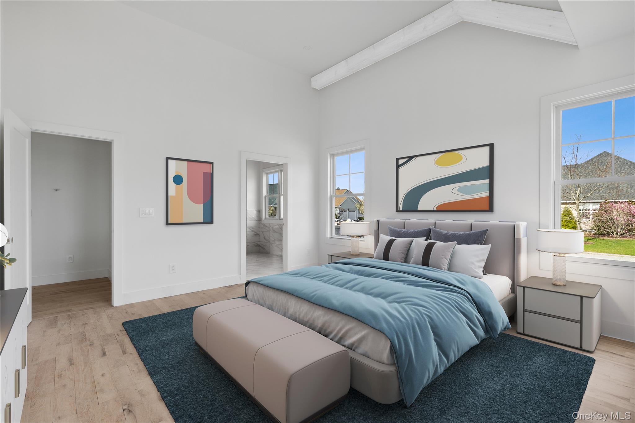 74 Tyler Drive Riverhead, NY 11901 - Photo 11 of 23 Bedroom with high vaulted ceiling, baseboards, ensuite bath, and light wood finished floors