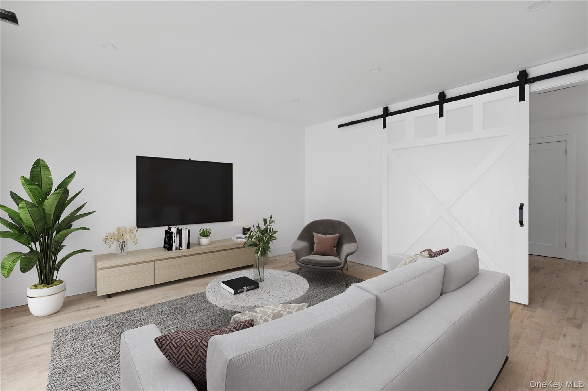 74 Tyler Drive Riverhead, NY 11901 - Photo 18 of 23 Living area featuring wood finished floors, recessed lighting, and a barn door