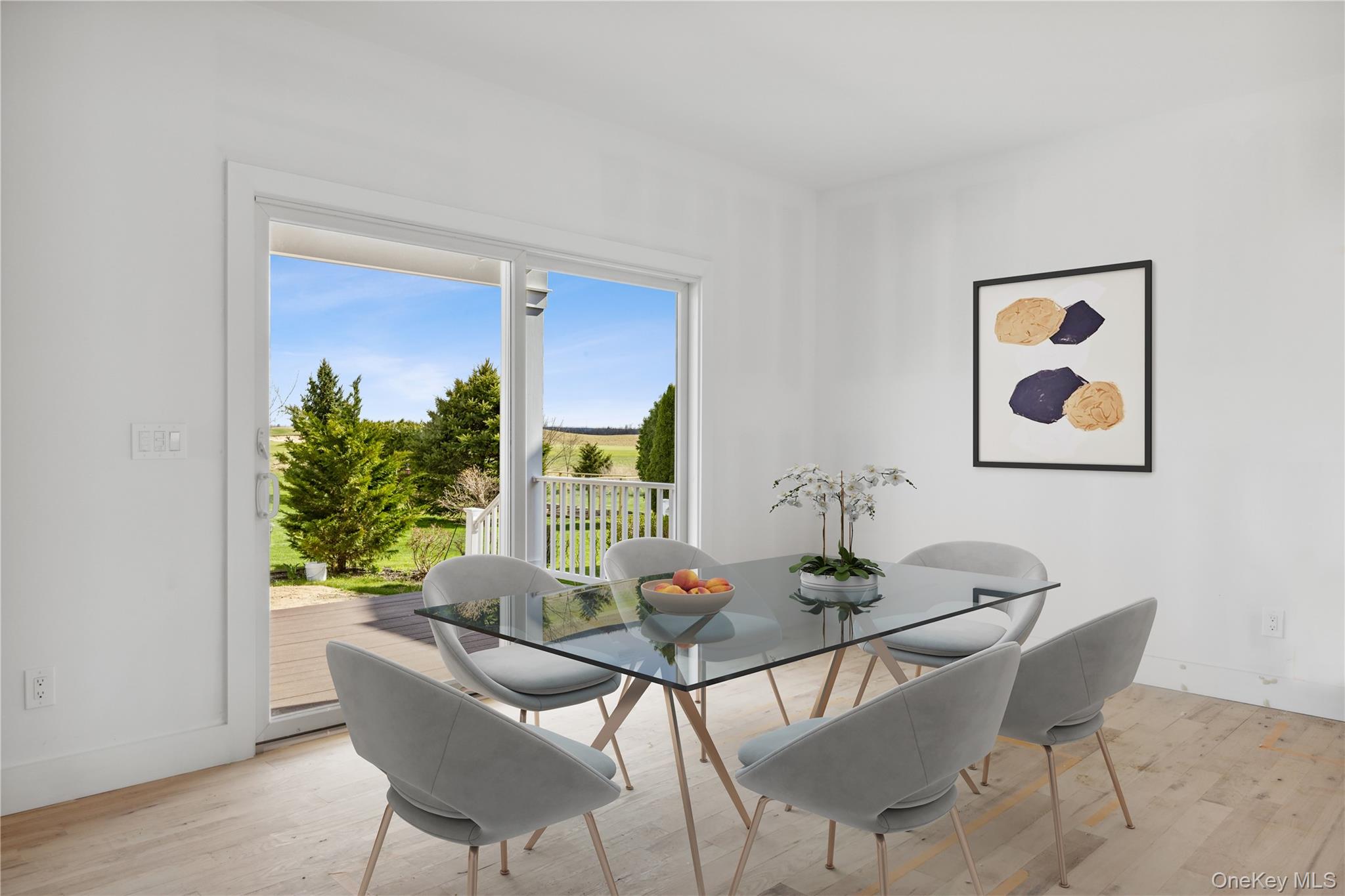 74 Tyler Drive Riverhead, NY 11901 - Photo 8 of 23 Dining area featuring light wood-style flooring and baseboards