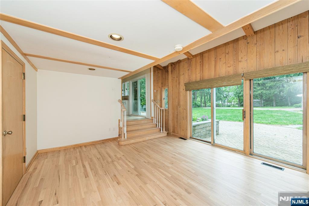 163 Sand Spring Road Morristown, NJ 07960 - Photo 13 of 39 a view of an empty room with wooden floor and a window