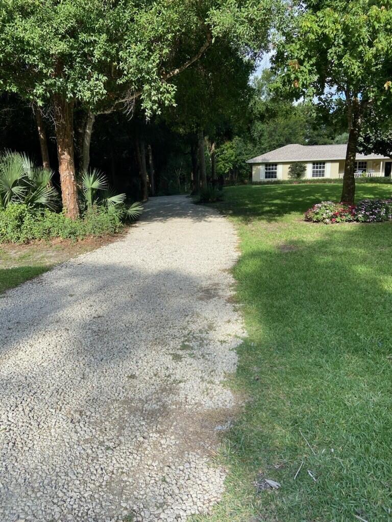 17861 Winterhawk Trail Jupiter, FL 33478 - Photo 49 of 64 Driveway to Game Room