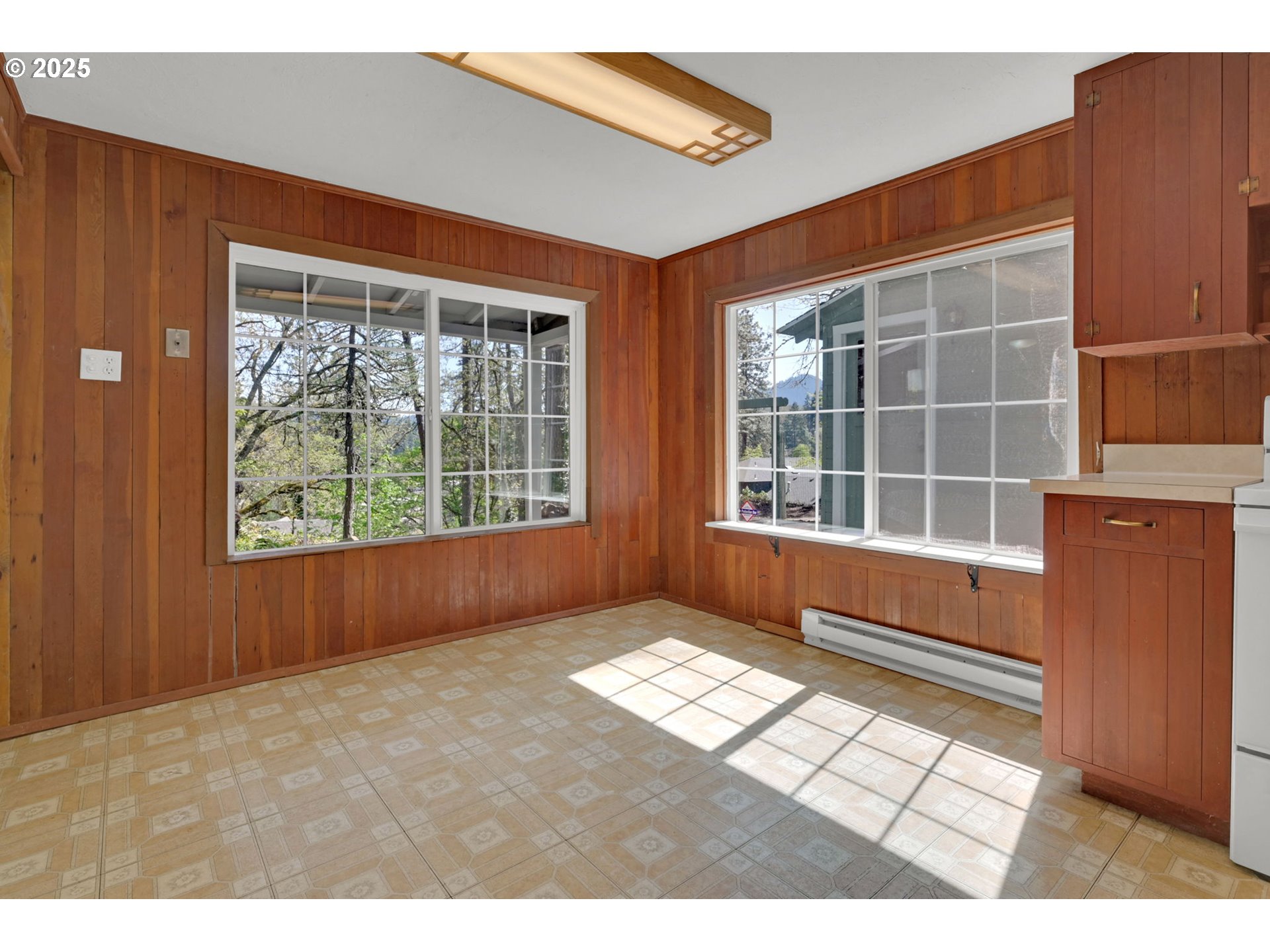 22 Prall Lane Eugene, OR 97405 - Photo 12 of 43 a view of an empty room with wooden floor and a window