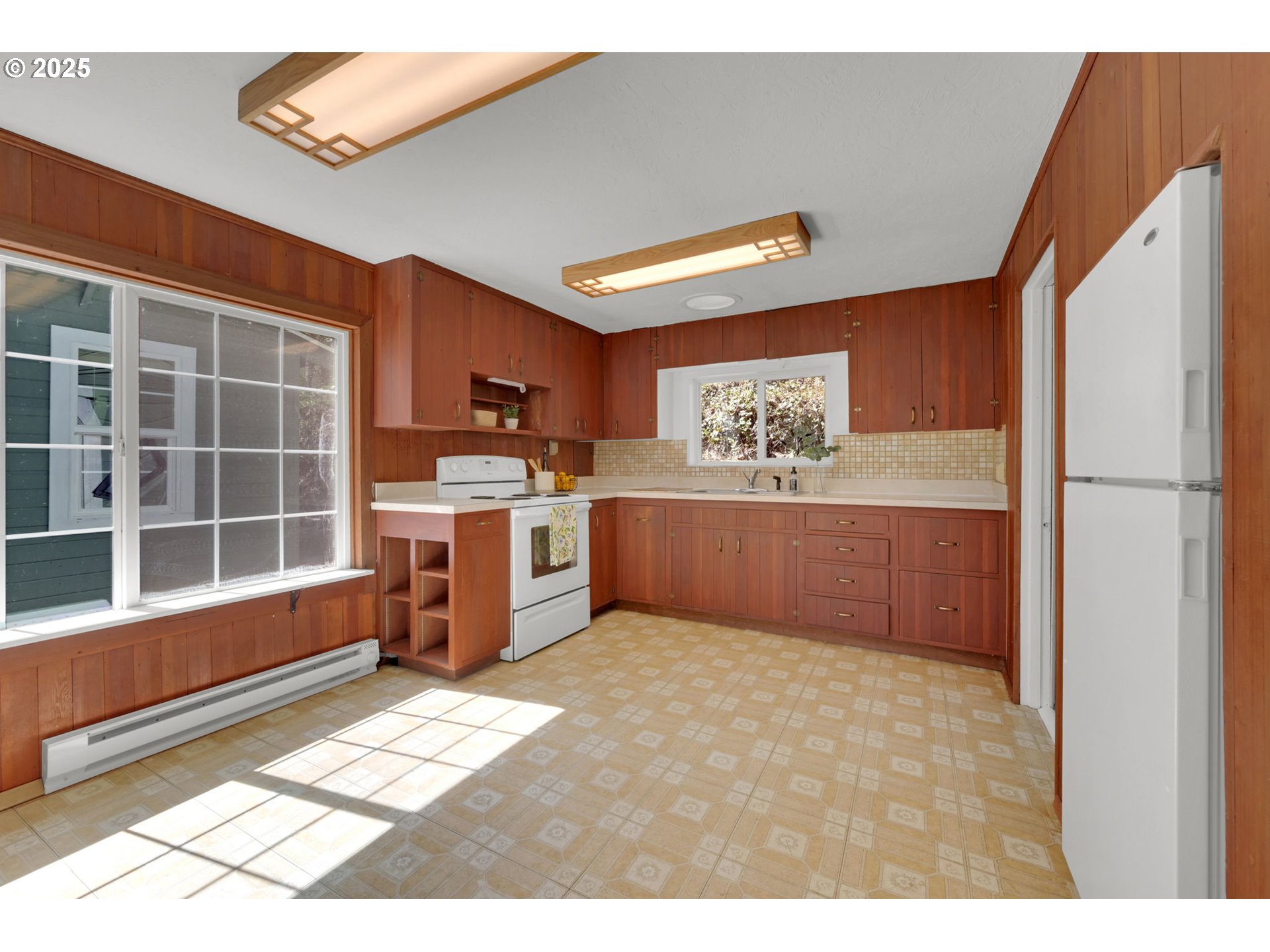 22 Prall Lane Eugene, OR 97405 - Photo 9 of 43 a kitchen with stainless steel appliances granite countertop a refrigerator and a stove top oven