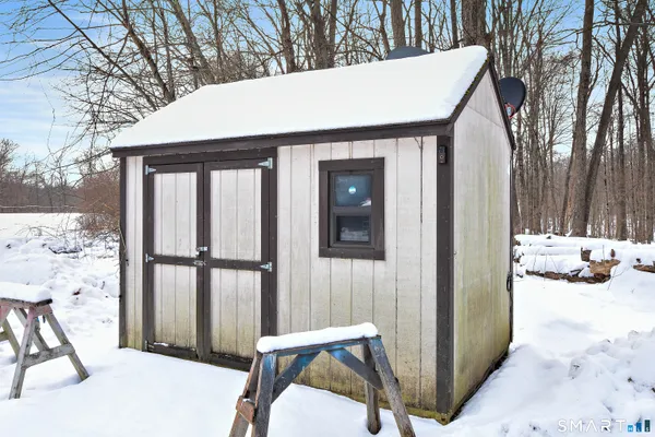 a view of a balcony with table and chairs