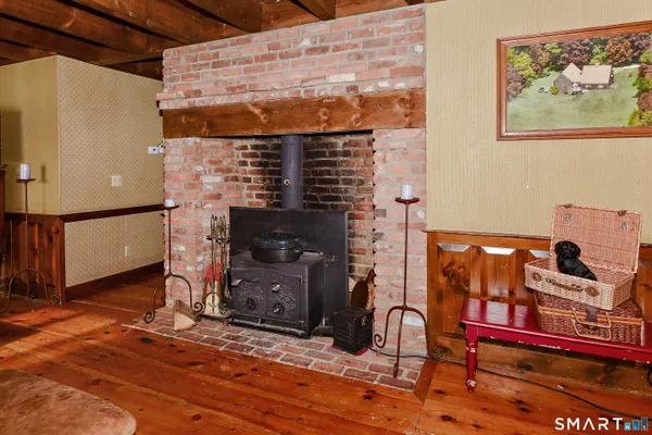 a view of a fireplace with wooden floor