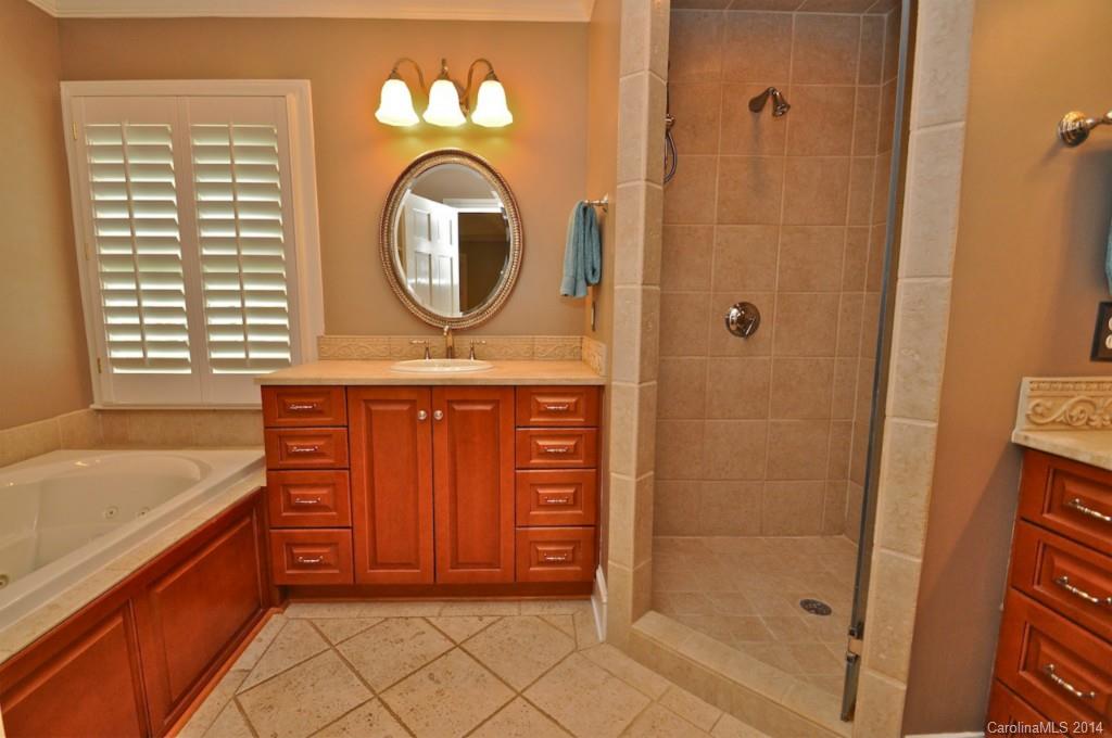 1931 Providence Road Charlotte, NC 28211 - Photo 15 of 22 a bathroom with a sink a mirror and a shower