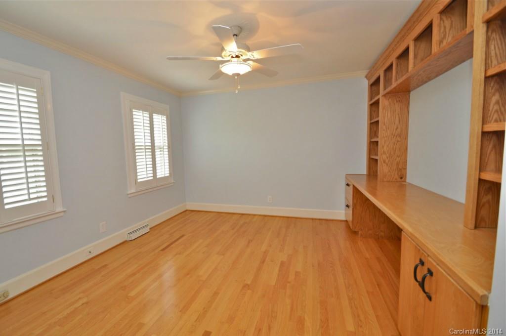1931 Providence Road Charlotte, NC 28211 - Photo 17 of 22 a view of an empty room with wooden floor and a window