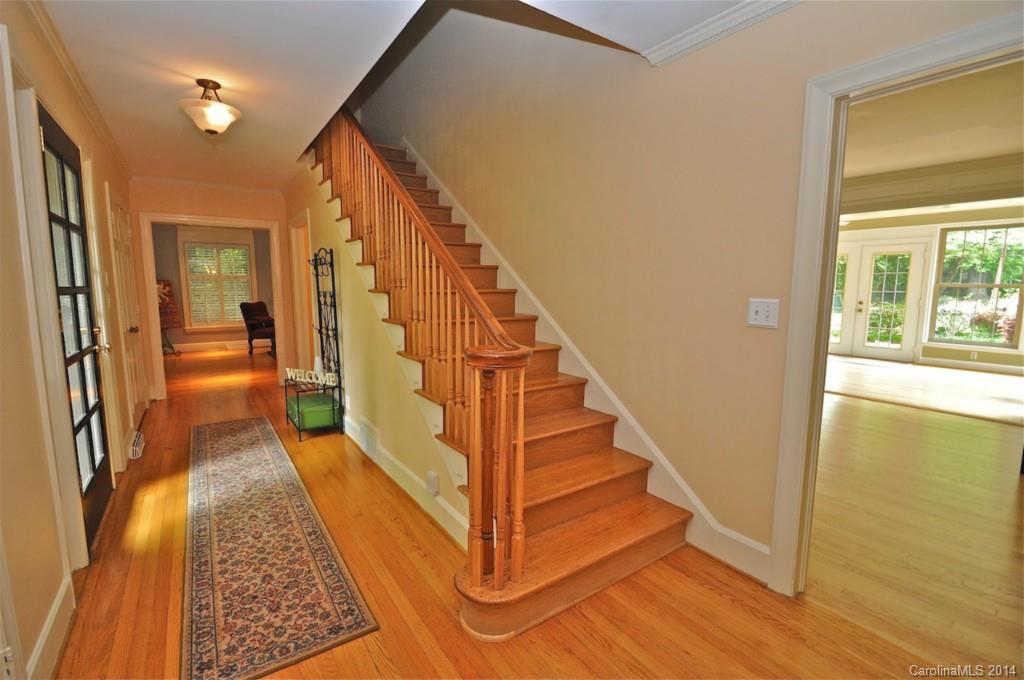 1931 Providence Road Charlotte, NC 28211 - Photo 3 of 22 a view of a hallway with wooden floor and staircase