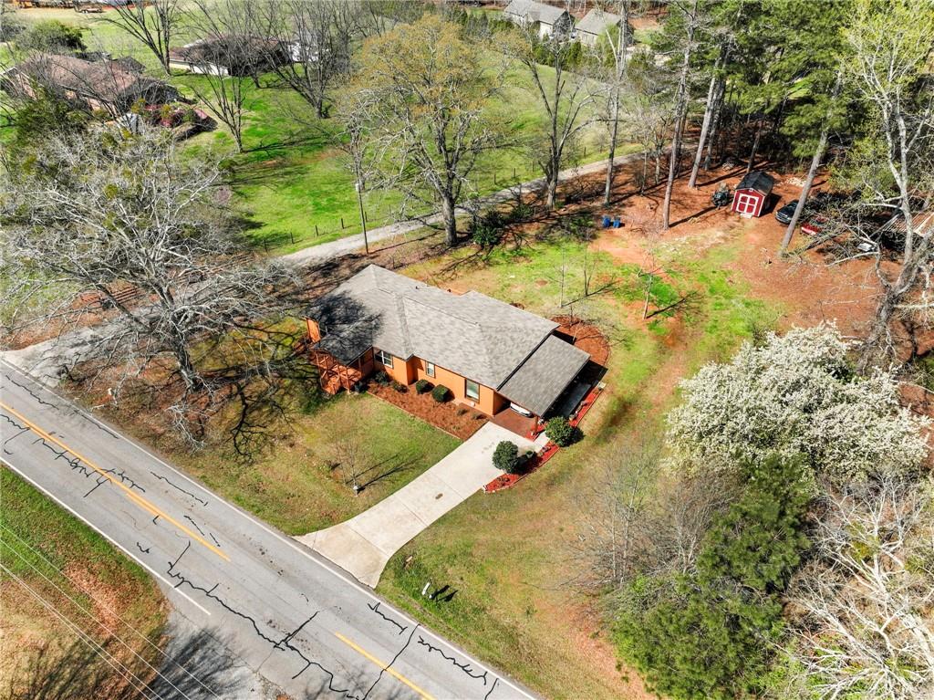 1686 Shoal Creek Road Monroe, GA 30656 - Photo 47 of 50 a view of a swimming pool with chairs