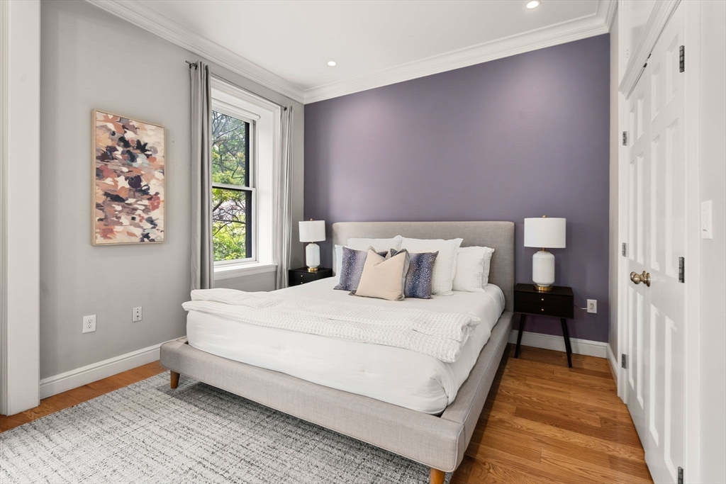 82 Berkeley Street, Unit 5 Boston, MA 02116 - Photo 12 of 31 a bedroom with a bed and a window