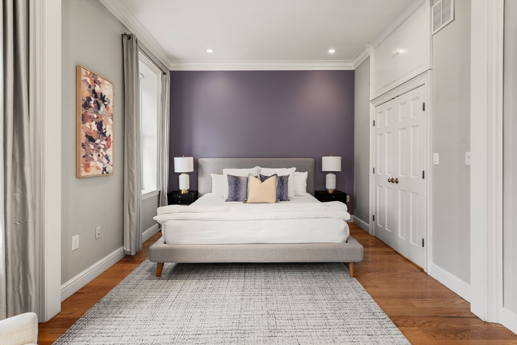 82 Berkeley Street, Unit 5 Boston, MA 02116 - Photo 13 of 31 a bedroom with a bed and a walk in closet