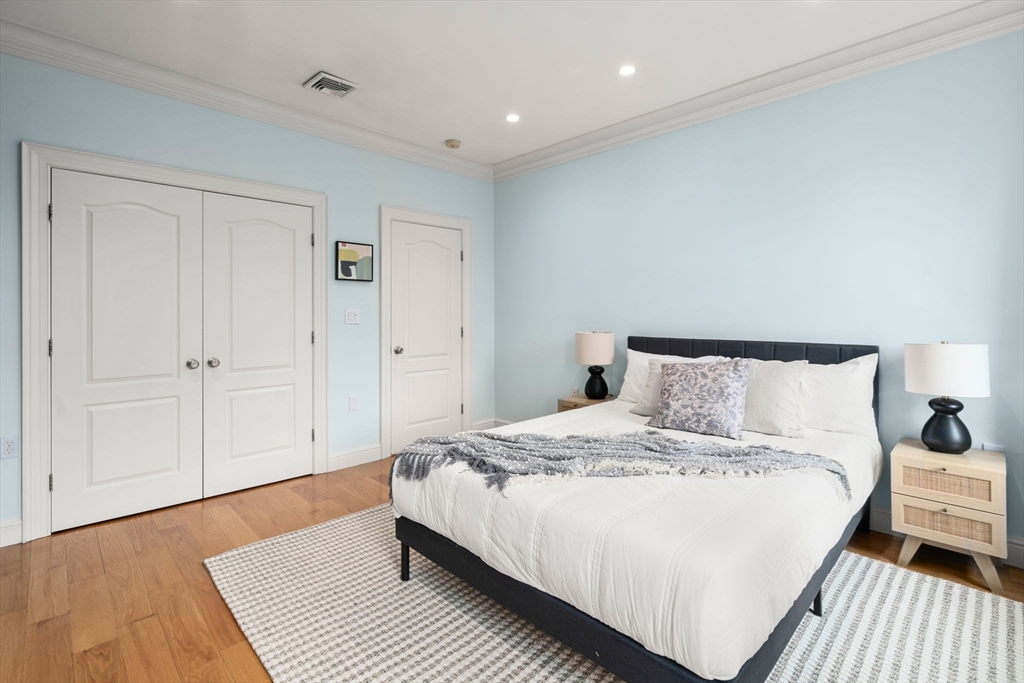 82 Berkeley Street, Unit 5 Boston, MA 02116 - Photo 20 of 31 a bedroom with a bed and a night stand